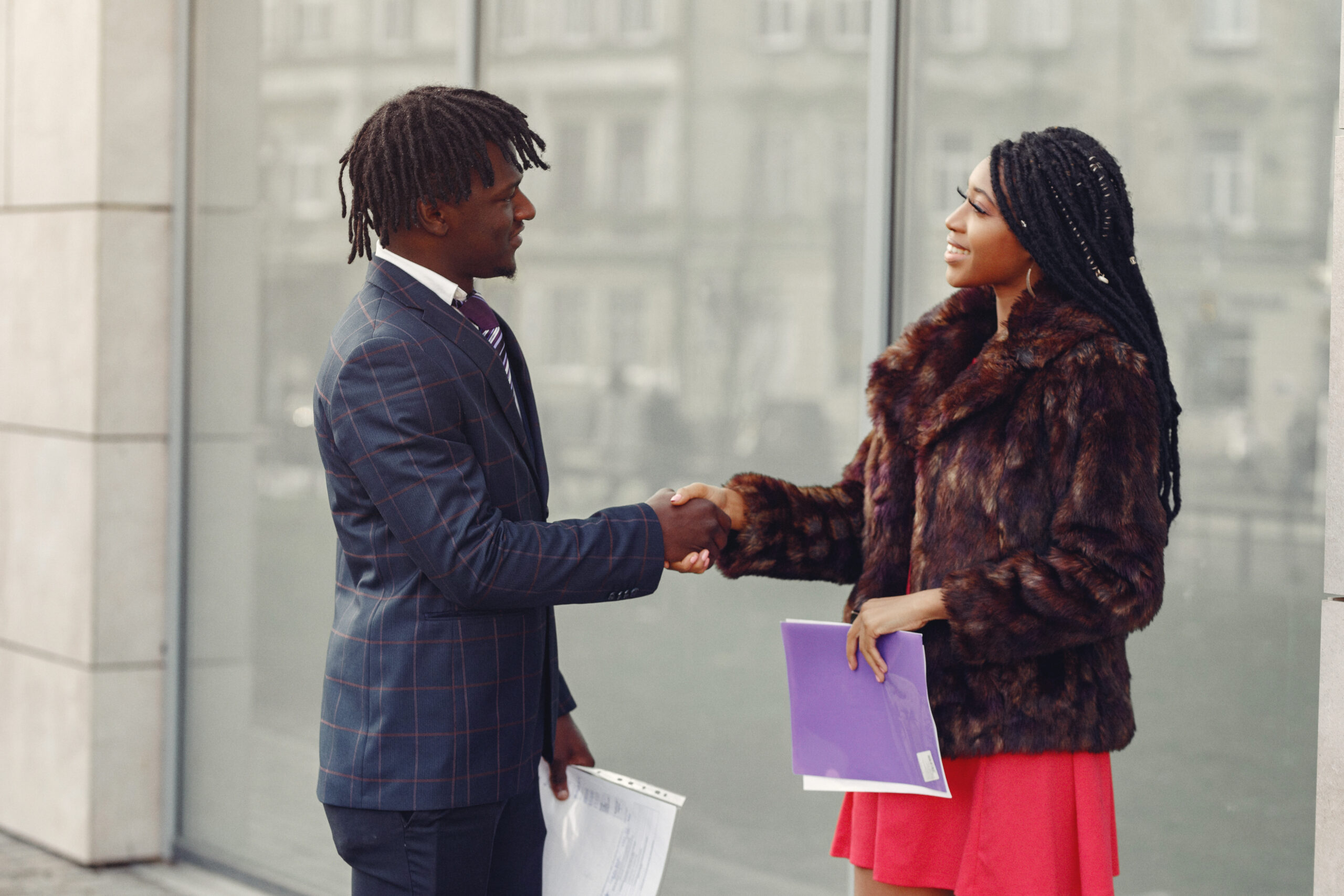 Stylish black couple have business conversation